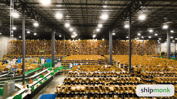 Hey there, friends! Imagine a vast warehouse that buzzes with the rhythm of perfection and efficiency. Picture rows upon rows of shelves stacked neatly with boxes, each home to what could be your next great purchase. Conveyor belts whir along smoothly—like a scene from one of those spectacular movies where everything fits just right into place—and meticulously arranged workstations stand ready for action. Now, as you take this in, let your eyes drift to a little corner on the bottom right where youll find the ShipMonk logo. Its not just a symbol; it represents one of the best third-party logistics services around—a genuine partner in getting things done right! So whether youre an e-commerce titan or dreamer setting sail on entrepreneurial waters, know that ShipMonk.com is here to navigate every logistical adventure with precision and care. Anchors aweigh!. via ShipMonk.com